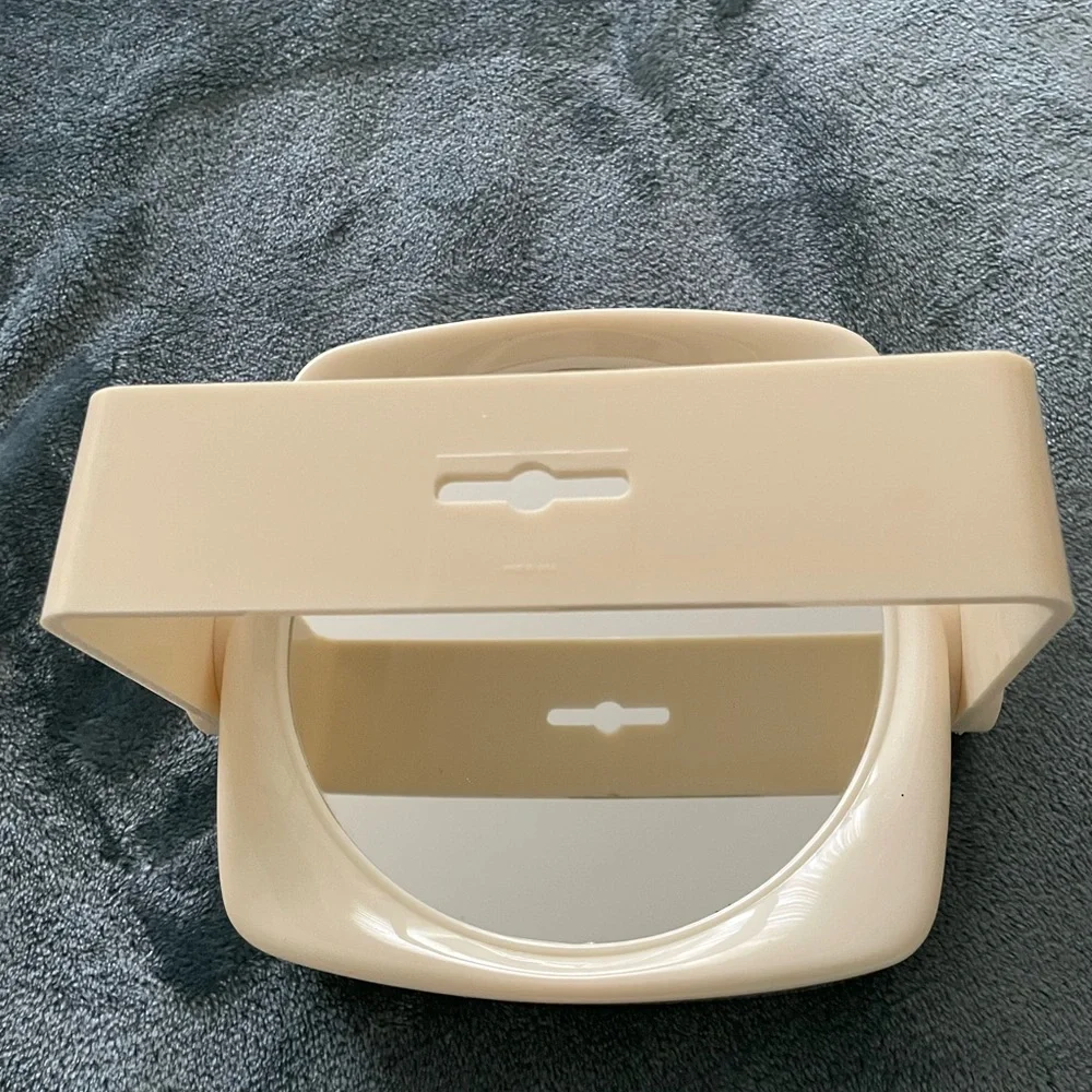 Makeup mirror on stand is a sturdy lucite case